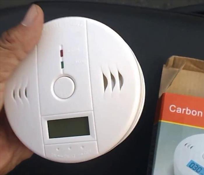 a carbon monoxide detector plugged into an outlet